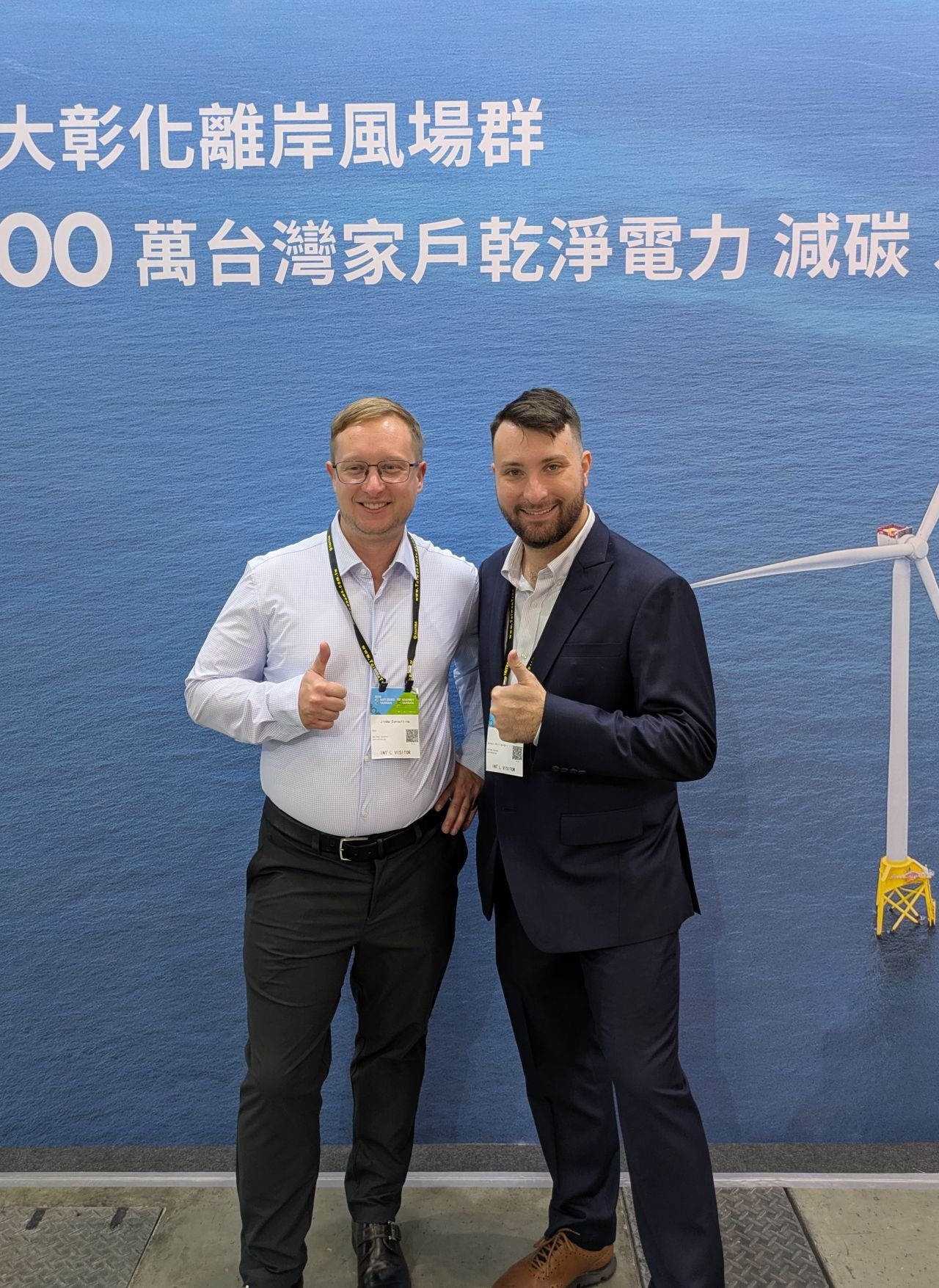 The Jinka team beside an offshore-wind display at Energy Taiwan.